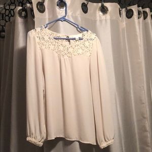 Cream blouse with lace and a bow in the back